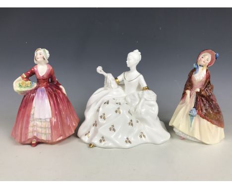 Three Royal Doulton figurines comprising Janet HN1537, Paisley Shawl HN1988 and Antoinette HN2326