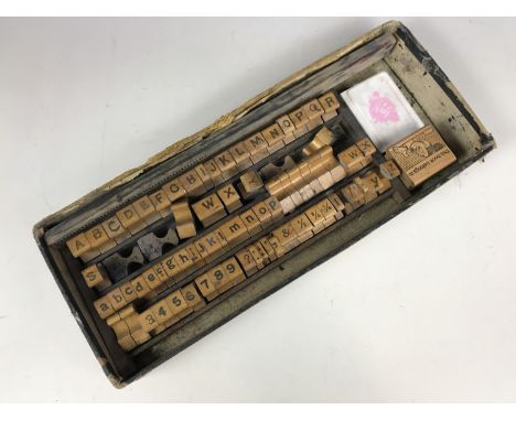 A vintage alphabet wooden printing block set