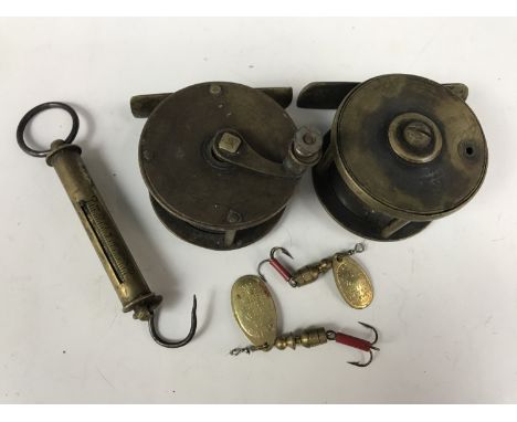 Two vintage small brass fishing reels together with a brass spring balance and two Mepps spinners