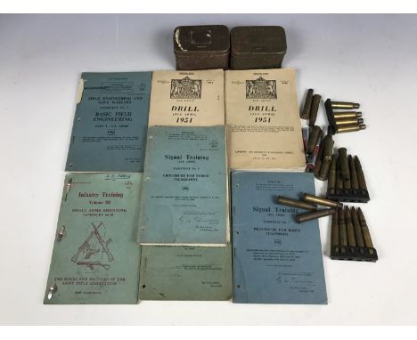 A quantity of inert rifle rounds, two Second World War artillery fuze tins and a quantity of British Army training manuals