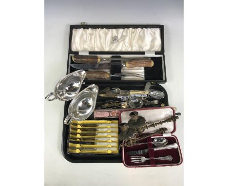 A quantity of vintage cutlery including a cased carving set together with a pair of electroplate sauce boats and a pair of ca