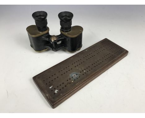 A set of First World War British Army prismatic binoculars, together with a cribbage board