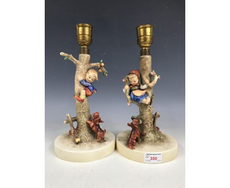 A pair of Goebel figural lamp bases with shades