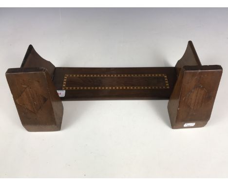 An inlaid book trough and bookends