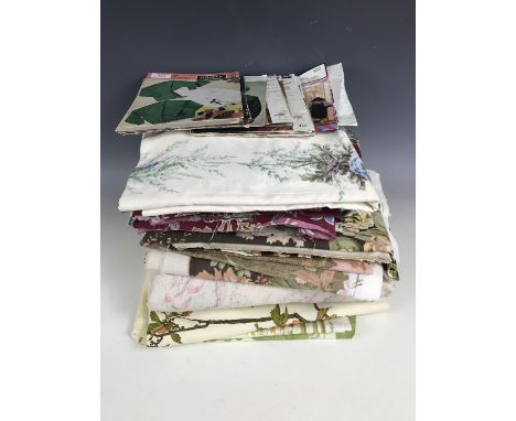 A quantity of vintage printed fabrics together with vintage knitting patterns  