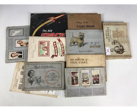 Vintage cigarette card albums featuring radio celebrities and film stars together with an Ace Space stamp album etc 