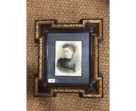 A Victorian tinted photographic portrait of a lady in fine parcel-gilt frame, 44 x 39 cm