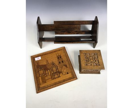 A vintage extendable wooden book trough together with a box and a wall plaque