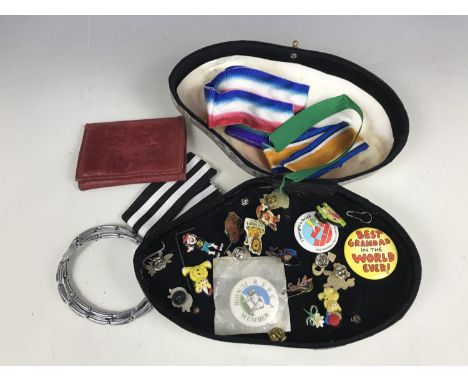 A polished shell box containing sundry badges, a quantity of military medal ribbon, vintage leather wallet and sleeve bands