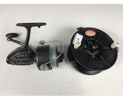 A vintage Academy centre pin fishing reel together with a Shakespeare 2240 II spinning reel