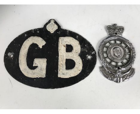 An RAC member's badge, number 06599, together with a vintage Royal Automobile Club GB alloy car badge