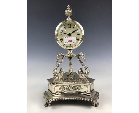 A reproduction electroplate mantel clock
