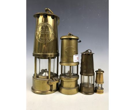 An Eccles The Protector Lamp & Lighting Co Ltd No. 6 miner’s safety lamp No 6 together with three others