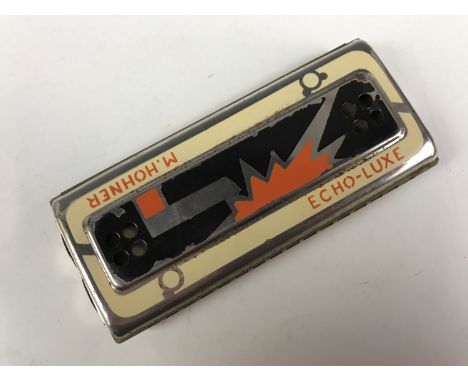 A vintage E. Hohner Echo-Lux harmonica