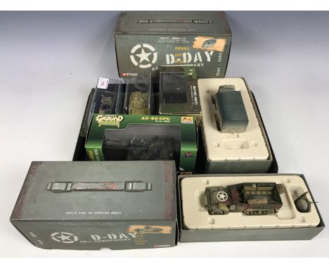 A D-Day 60th Anniversary M3 A1 half tank together with a Bedford QI.D and other model army vehicles
