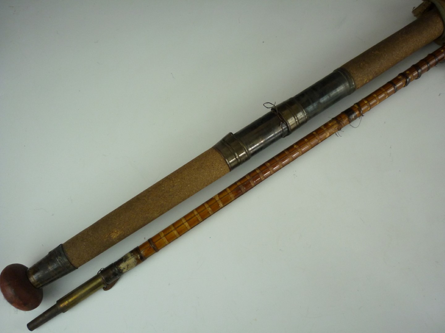 Two vintage threepiece cane fishing rods, by Cummins of