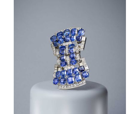 Mauboussin, an Art Deco sapphire and diamond double clip brooch, France, circa 1935, designed as a geometrically stylised bow