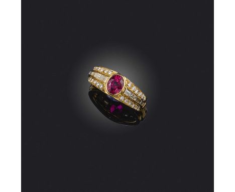 A ruby and diamond ring, set with an oval ruby within diamond-set shoulders in yellow gold, size M