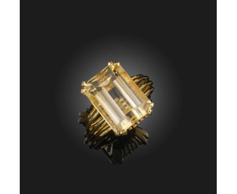 A citrine mounted gold ring, the step-cut citrine claw-set in 18ct yellow gold, size M