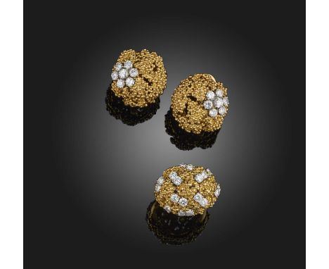 Boucheron, a gold and diamond demi-parure, 1970s, comprising: a pair of ear clips and a ring, each composed of textured gold,