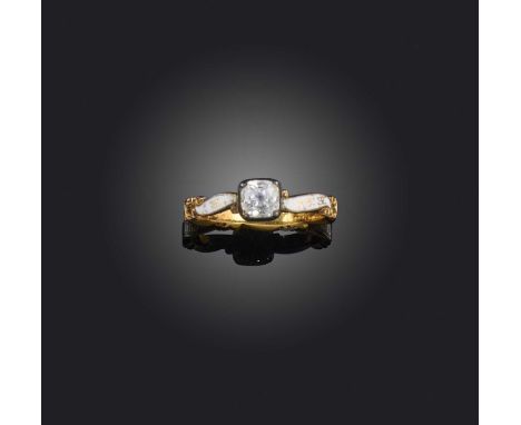 A rock crystal and enamel mourning ring mid 18th century, set with a cushion-shaped rock crystal, to a scrolling white enamel