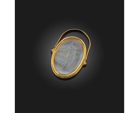 A neoclassical intaglio ring, early 19th century, the pale oval agate engraved with a depiction of the goddess Hygieia holdin