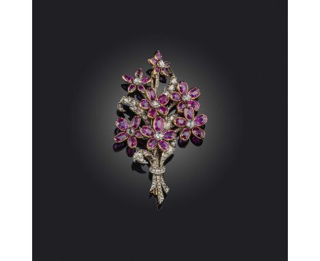 A ruby and diamond brooch, designed as a bouquet of flowers, set with rose-cut diamonds and oval rubies, mounted in silver an