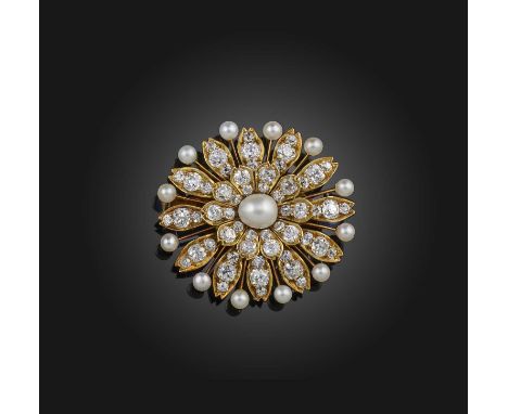 A pearl and diamond brooch, late 19th century, designed as a flower, centring on a pearl measuring 8.2 x 7.0mm, within a bord