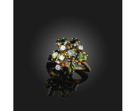 A tourmaline and diamond cluster ring, set with oval green tourmalines and diamonds all claw-set in yellow gold, maker JA and