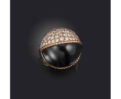 Cartier, a diamond bombe ring, of hemispherical design, half formed of black jade, the other half pave-set with diamonds in 1