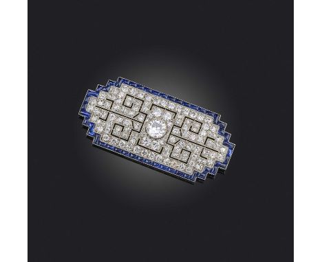 A fine Art Deco sapphire and diamond brooch, 1920s, centring on a circular-cut diamond weighing approximately 1.20 carats, wi