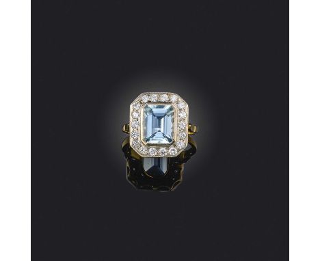 An aquamarine and diamond ring, collet-set with a step-cut aquamarine weighing approximately 3.20 carats, within a border of 