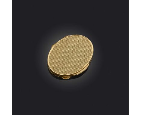 An oval gold pill box, with engine turned decoration, hinged opening, signed Cartier London and stamped 750, length 4.7cm, 33