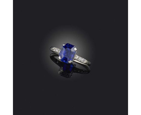 An Art Deco sapphire and diamond ring, 1920s, set with a step-cut sapphire weighing approximately 2.50 carats, to shoulders s