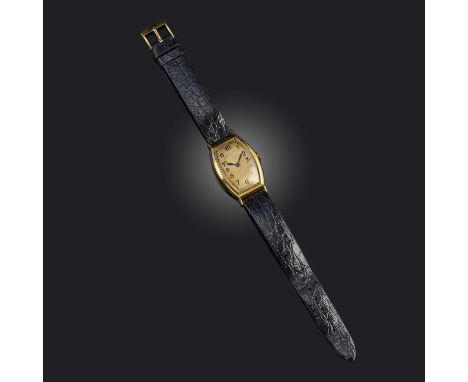 Patek Philippe, a gentleman's gold dress watch, mid 20th century, tonneau-shaped gilt dial with black enamel indicators and b