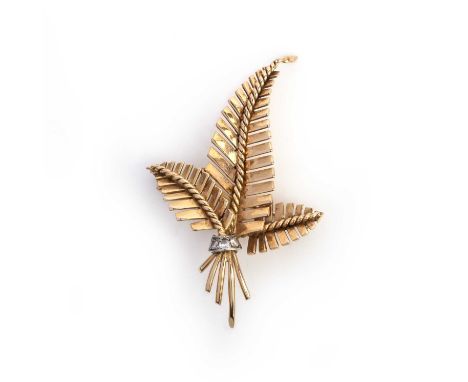 Garrard, an 18ct gold fern leaf brooch, of stylised design tied with a diamond-set ribbon, London import marks for 1954, make