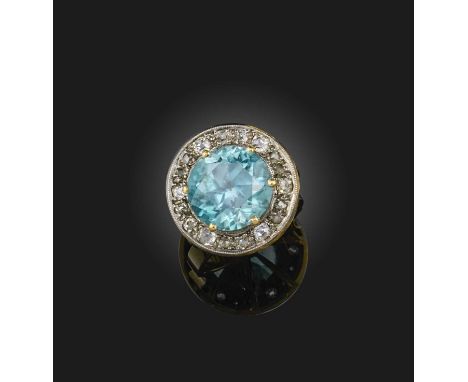 A blue zircon and diamond ring, of cluster design, set with a circular-cut blue zircon within a border of cushion-shaped and 