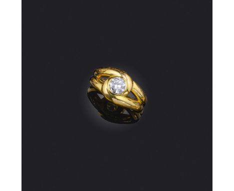 A gold and diamond ring, the round brilliant-cut diamond weighing approximately 0.95 carats, within a twisted yellow gold set