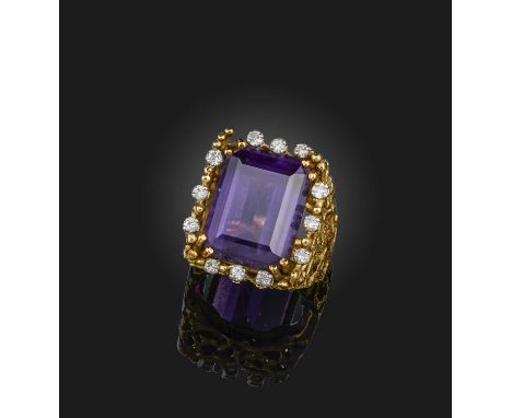 George Weil, an amethyst and diamond ring, 1970s, set with a step-cut amethyst, within a border of brilliant-cut diamonds, to