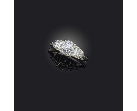 Hans D. Krieger, a diamond ring, centring on a circular 'Crown of Light' -cut diamond weighing 2.12 carats, to stepped should