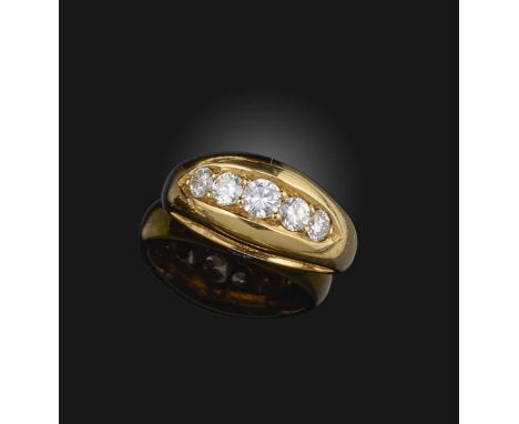 A diamond five stone ring, 1904 and later, set with graduated round brilliant-cut diamonds in polished yellow gold setting, m