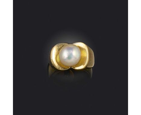 A natural pearl ring, mid 20th century, set with a pearl measuring approximately 10.31 x 9.73 x 8.74mm, mounted in gold, size