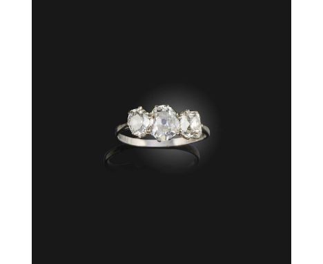 A diamond three-stone ring, early 20th century, set with three cushion-shaped diamonds, mounted in platinum, size S