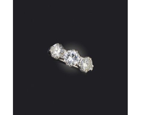 A diamond three stone ring, set with graduated round brilliant-cut diamonds weighing approximately 2.40cts, in platinum, size