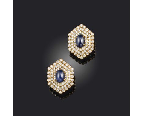 Vourakis, a pair of sapphire and diamond ear clips, each of hexagonal outline, set with cabochon sapphires within a triple bo