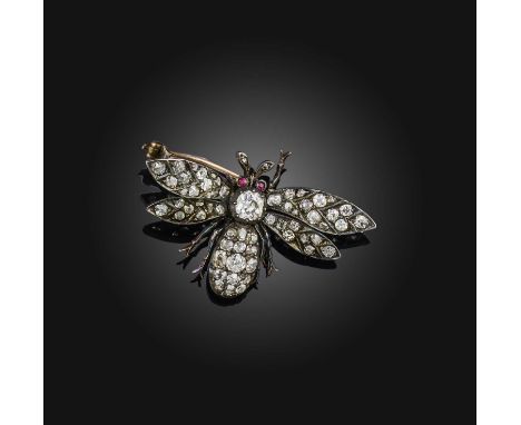 A Victorian diamond and ruby brooch, late 19th century, designed as a bee, set with cushion-shaped and rose-cut diamonds, its