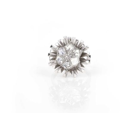 Φ Φ John Donald, a diamond ring, circa 1965, centring on a star motif set with six kite-shaped diamonds, within an abstract r