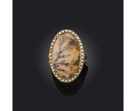 A late 18th century moss agate and seed pearl ring, the central moss agate plaque set within a border of seed pearls in yello