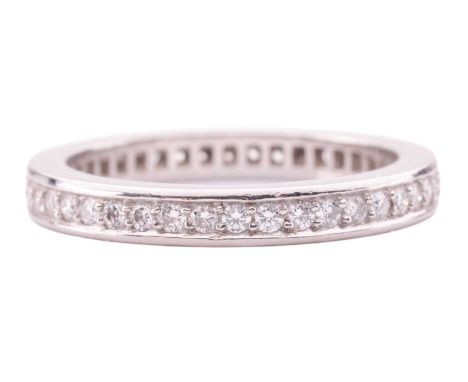 A diamond-set full eternity ring, featuring round brilliant diamonds, with an estimated total carat weight of approximately 0