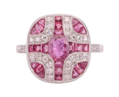 An Art Deco-style ruby and diamond plaque ring, featuring an oval mixed-cut ruby, centrally-set with calibre-cut rubies and s
